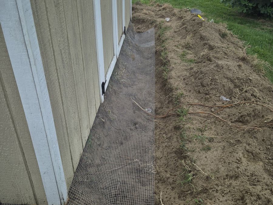 Buried mesh along the foundation stops digging under the structure.